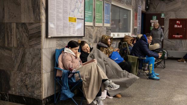 People shelter at the metro station during a Russian drone and missile attack in Kyiv