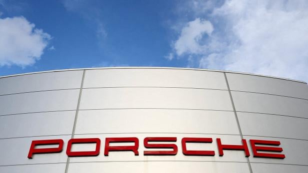 FILE PHOTO: A logo of Porsche is seen outside a Porsche car dealer in Brussels