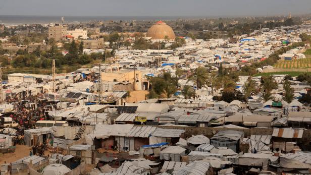 Displaced Palestinians shelter at a tent camp in Khan Younis