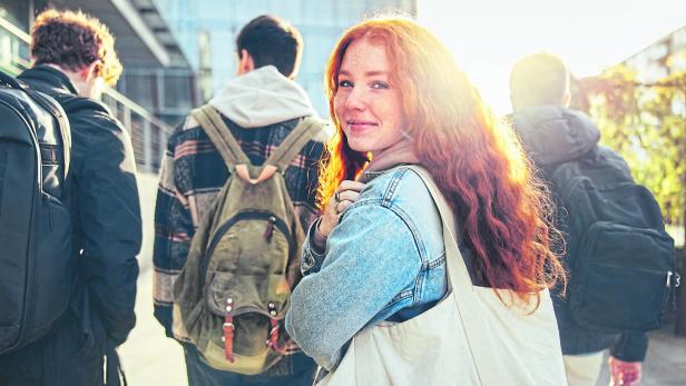Female student going for class in high school