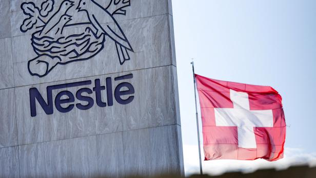 FILE PHOTO: A Swiss flag flutters on the headquarters of Nestle in Vevey