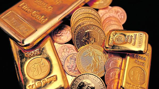 FILE PHOTO: UK gold bars and coins are displayed in London