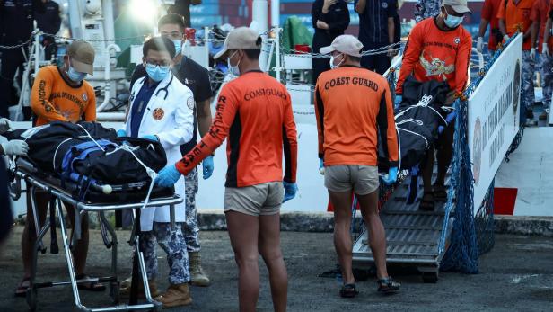 Seafarers who survived the sinking of the cargo ship M/V Devon Bay return to Manila