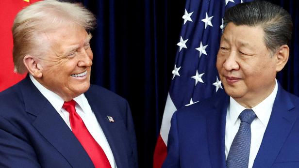 FILE PHOTO: U.S. President Donald Trump meets with Chinese President Xi Jinping on the sidelines of the APEC summit, in Busan