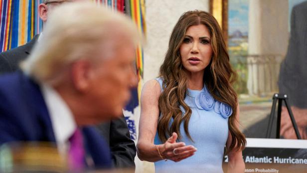 FILE PHOTO: U.S. President Trump and Homeland Security Secretary Kristi Noem at the White House, in Washington