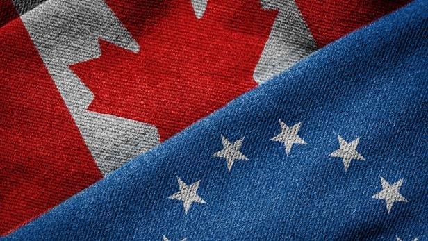 CETA Concept: Flags of EU and Canada on Grunge Texture