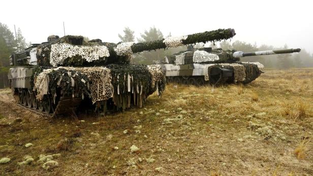 Danish army Leopard 2A7 tanks and Estonian army CV-90 infantry fighting vehicles attend live shooting exercise in Perakula