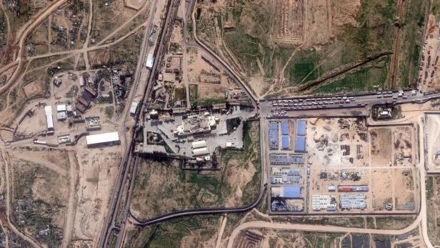 A satellite image shows trucks amassed at the Rafah border crossing