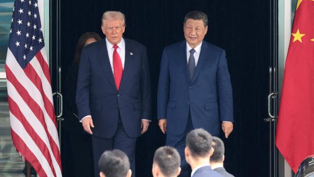 FILE PHOTO: U.S. President Donald Trump meets with Chinese President Xi Jinping on the sidelines of the APEC summit, in Busan