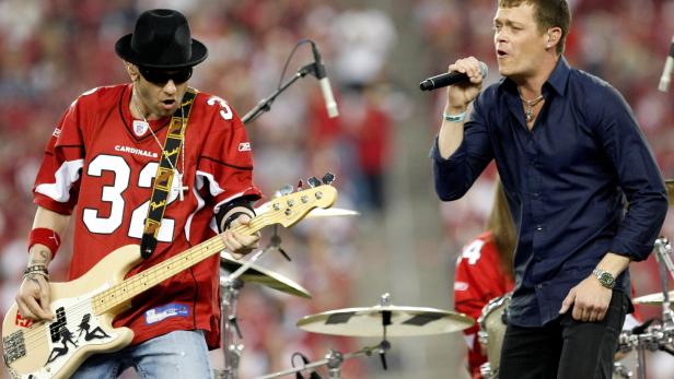 FILE PHOTO: Arnold and Harrell of the rock band "3 Doors Down" perform at halftime during NFL Wild-Card Round playoff football game in Glendale
