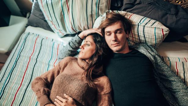 couple resting in the bedroom