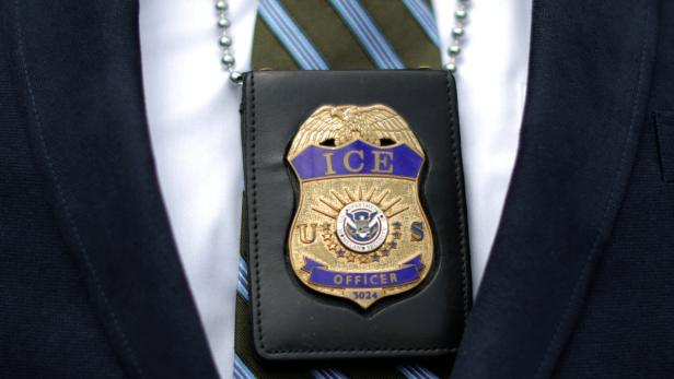 FILE PHOTO: An ICE officer is seen at Otay Mesa immigration detention center in San Diego