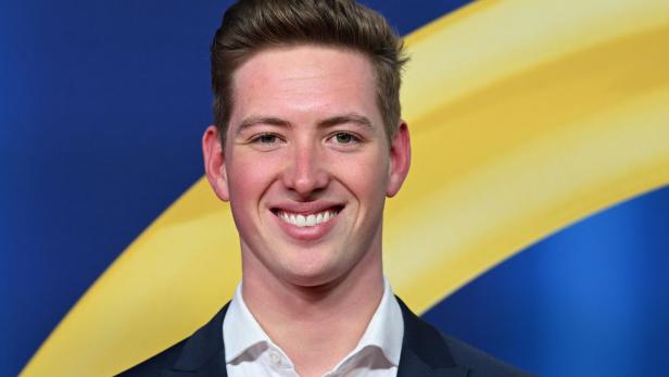 David Schumacher grinst