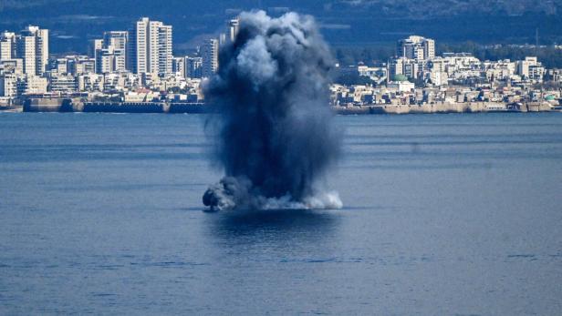 Explosion in the sea after missiles were launched towards Israel from Iran, as seen from Haifa