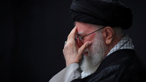 FILE PHOTO: Iran's Supreme Leader Ayatollah Ali Khamenei attends a mourning ceremony for the deaths of Iranian military commanders and scientists, in Tehran