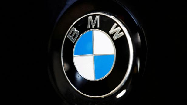 FILE PHOTO: A logo of BMW is seen inside a car dealer in Nijmegen