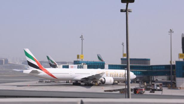 Planes are parked at Terminal 3 of the Dubai International Airport