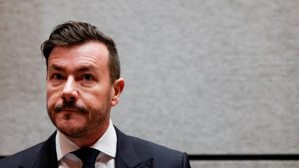 FILE PHOTO: Austrian former property tycoon Rene Benko arrives in the courtroom as a second insolvency fraud trial starts in Innsbruck