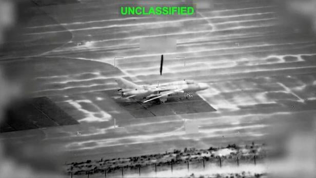 FILE PHOTO: A projectile falls on an aircraft at an unknown location in the still image obtained from a video released by U.S. Central Command (CENTCOM)