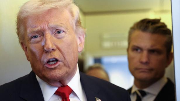 Trump speaks to reporters aboard Air Force One