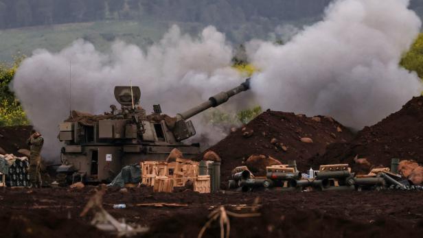 An Israeli artillery unit fires, on the Israeli side of the Israel-Lebanon border