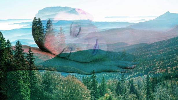Double exposure of woman portrait and landscape