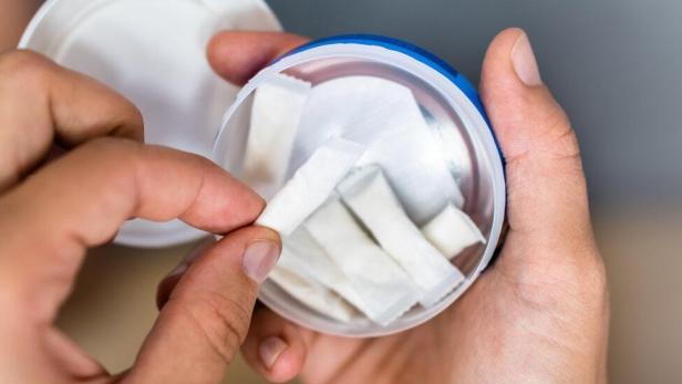 Woman Chewing Wet Moist Nicotine Product