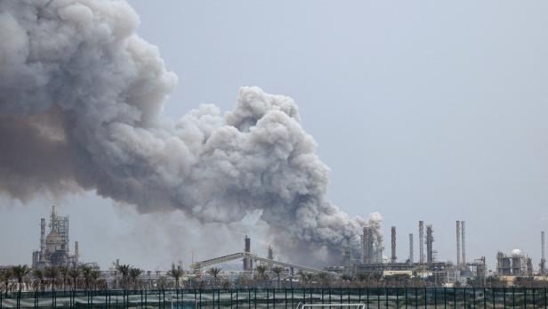 FILE PHOTO: Smoke rises following a strike in Sitra Island