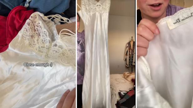 Weißes Seidenkleid mit Spitzenapplikationen und Dior-Etikett wird ausgebreitet gezeigt.