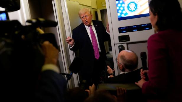 U.S. President Donald Trump on board Air Force One for travel to Joint Base Andrews