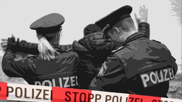 Zwei Polizisten bei einer Festnahme