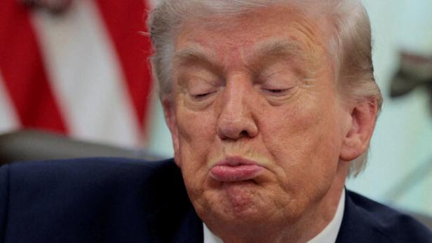 FILE PHOTO: U.S. President Trump signs an executive order in the Oval Office of the White House