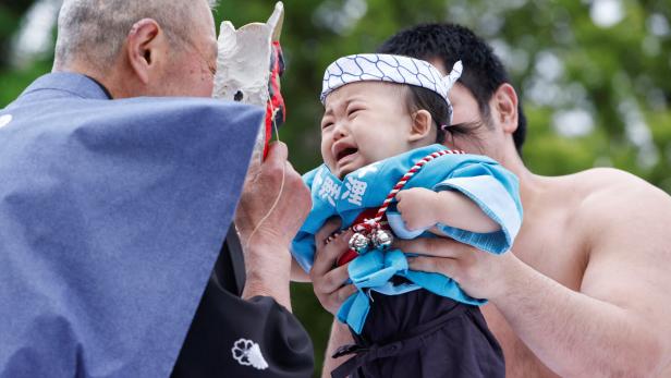 Babies take part in 'Nakizumo' or baby crying sumo contest at Senso-ji temple in Tokyo