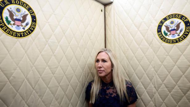 U.S. Representative Marjorie Taylor Greene (R-GA) walks to her final vote, surrounded by staff, in Washington