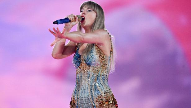 FILE PHOTO: Taylor Swift performs as her record-breaking The Eras Tour comes to an end in Vancouver