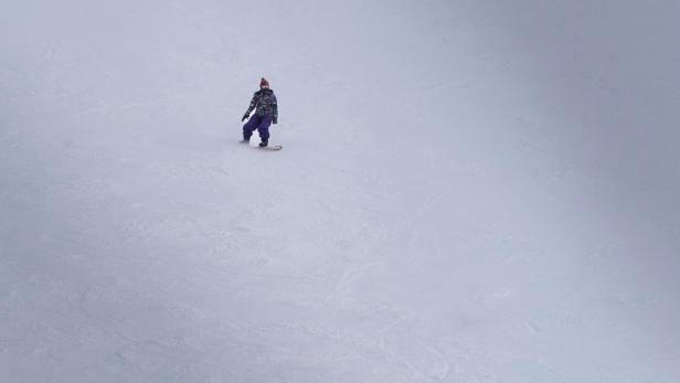 Snowboarder auf der Piste