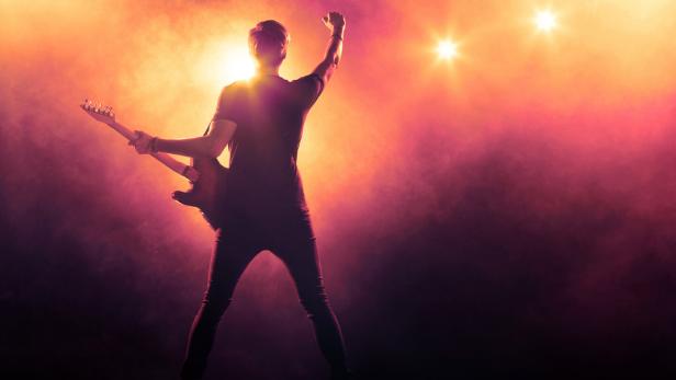 Guitarist playing a guitar on stage