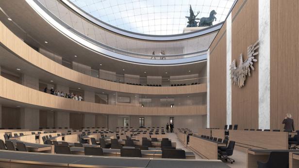 Innenansicht eines Plenarsaals mit Zuschauerrängen und einem großen Adler an der Wand.