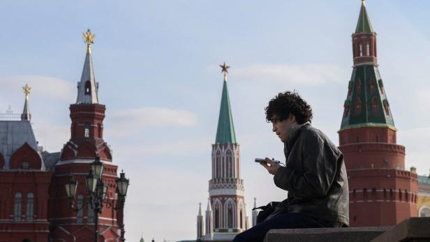 A man checks his mobile phone in central Moscow