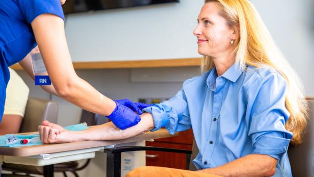 Blond Woman Phlebotomy Blood Draw in Hospital