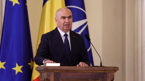 FILE PHOTO: Romania's Prime Minister Bolojan speaks during a swearing in ceremony in Bucharest