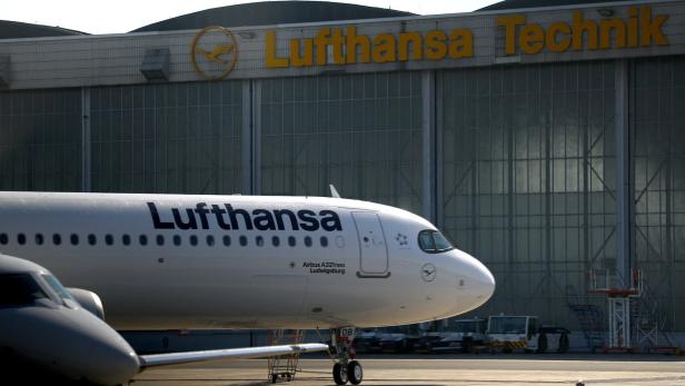 An aircraft of German air carrier Lufthansa parks at the Berlin Brandenburg Airport in Schoenefeld