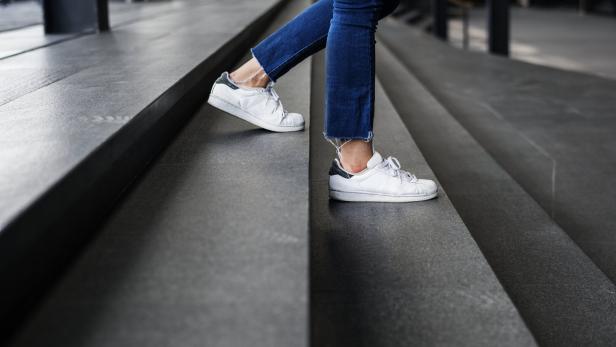 Closeup of person walking down the stairs