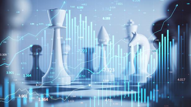 Chess pieces overlaying financial data graphs with blue digital light effects on a blurred background.
