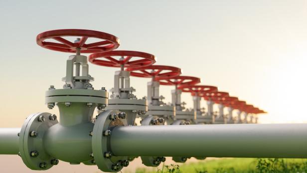 Oil, Gas Or Water Transportation With Pipe Line Valves On Grass.