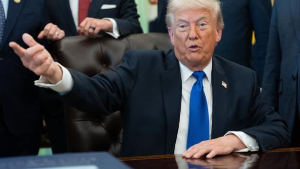 US President Donald Trump signs executive orders at White House
