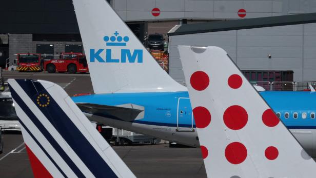 The tails of Air France, KLM and Brussels Airlines planes on the tarmac at Manchester Airport in Manchester