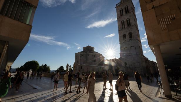 People walk in the old town of Zadar