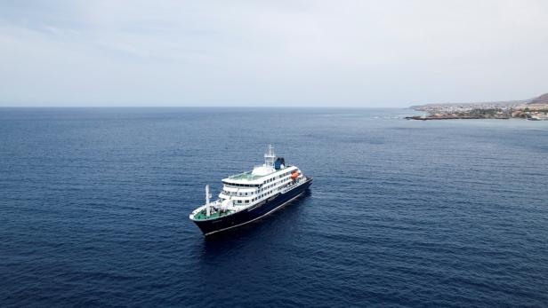 FILE PHOTO: A drone view of the cruise ship MV Hondius, carrying passengers suspected of having cases of hantavirus on board, as it prepares to leave Praia