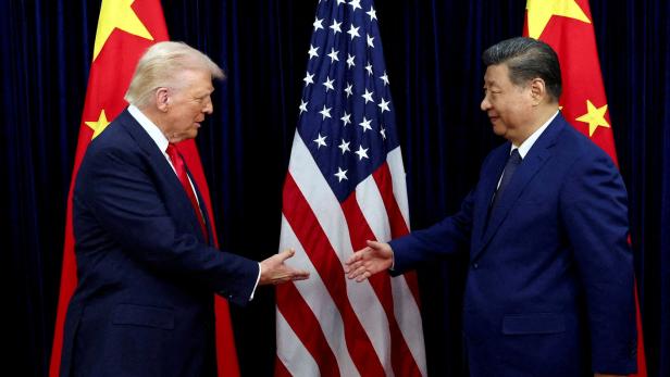 FILE PHOTO: U.S. President Donald Trump meets with Chinese President Xi Jinping on the sidelines of the APEC summit, in Busan